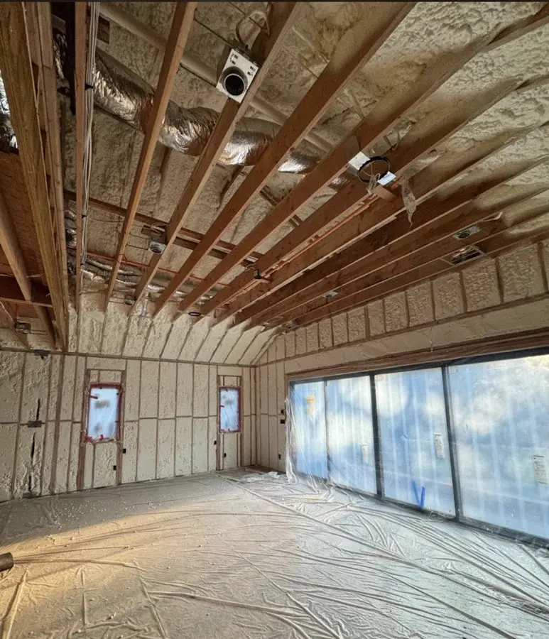 Interior walls and ceiling insulated with spray foam during new construction in Barrington